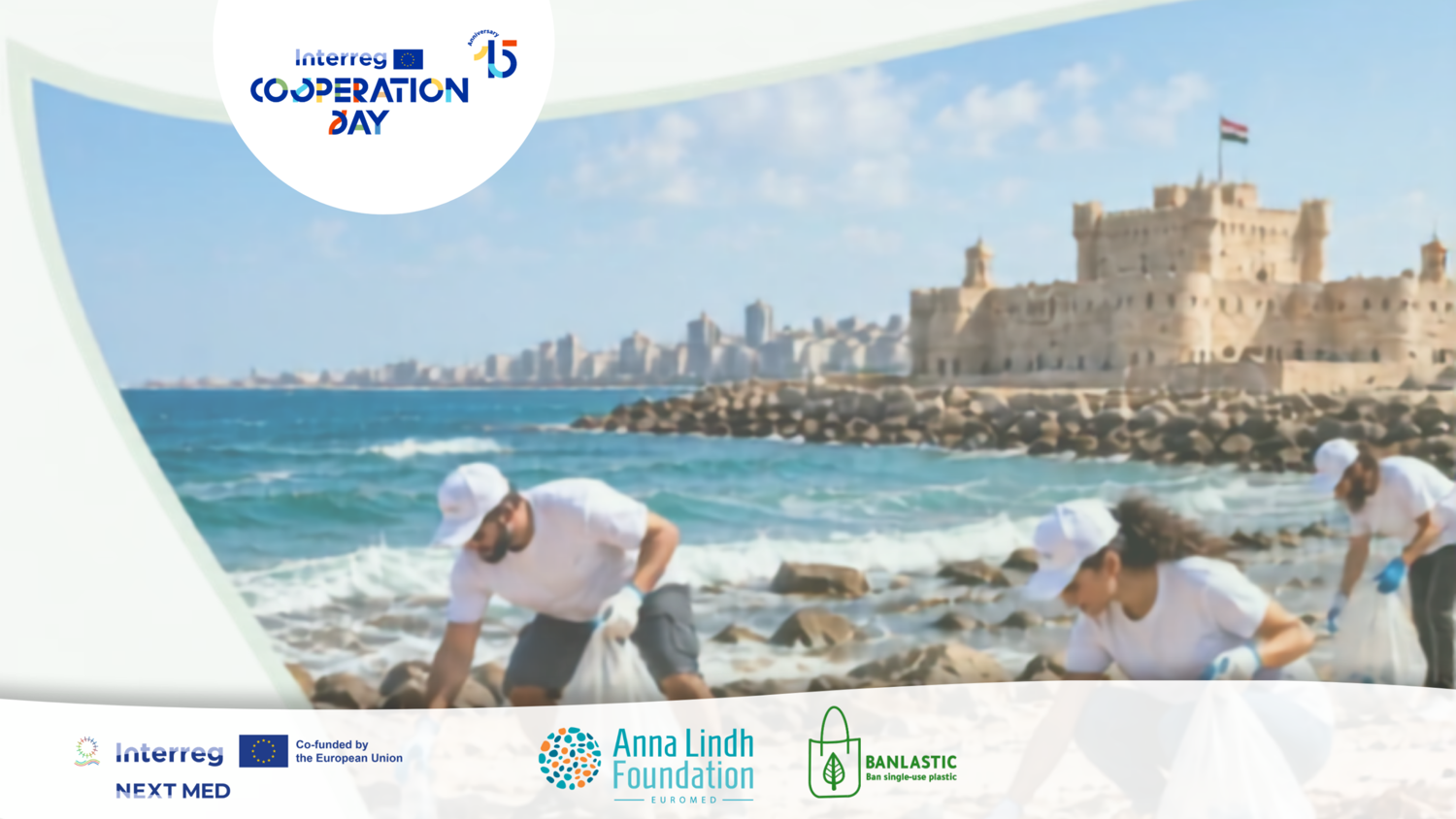 Volunteers in white shirts and caps clean up trash along a rocky beach with a historic fortress and city in the background. Logos for Interreg, Anna Lindh Foundation, and Banlastic are shown at the bottom.