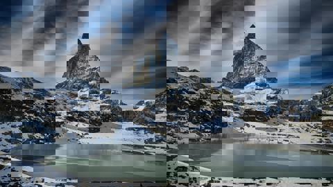 The image appears to be corrupted or glitched, displaying horizontal bands of distorted colors including purple, blue, cyan, and green, making the original content of the image unrecognizable.