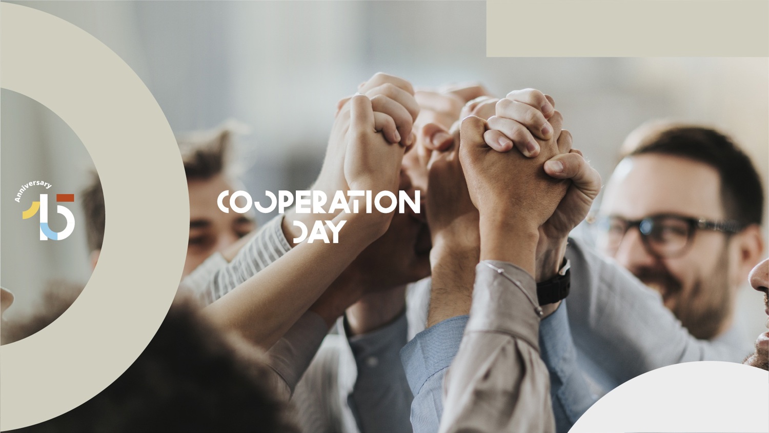 Several people standing close together raise their joined hands in a gesture of unity. The words "Cooperation Day" and a colorful "15" logo appear on the image.