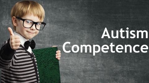 A young boy with glasses gives a thumbs up, wearing a striped sweater and bow tie, standing in front of a blackboard with the words "Autism Competence" written on it.