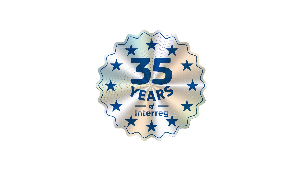 A wavy-edged badge features blue stars and text reading "35 Years of Interreg" in the center, marking the 35th anniversary of the Interreg program.