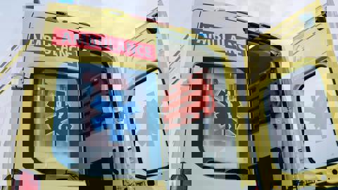 The image shows three yellow ambulances parked side by side, with the word "AMBULANCE" visible on their fronts. The image is digitally distorted, making details appear wavy and unclear.