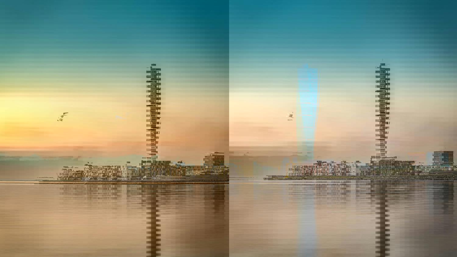A cityscape with buildings and a tall tower reflected in calm water at sunset, overlaid with digital glitch effects and diagonal pixelated lines, and a bird flying in the sky.