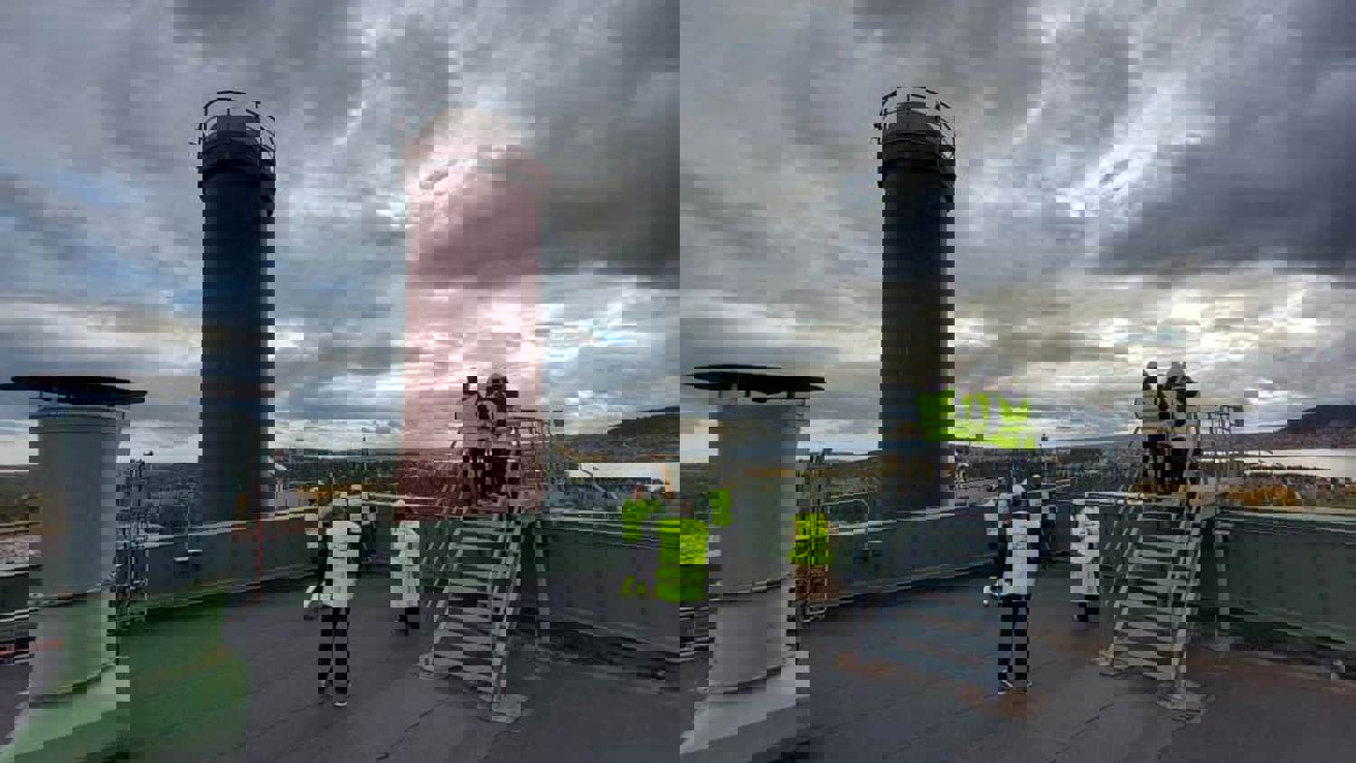 A group of people on a roof.