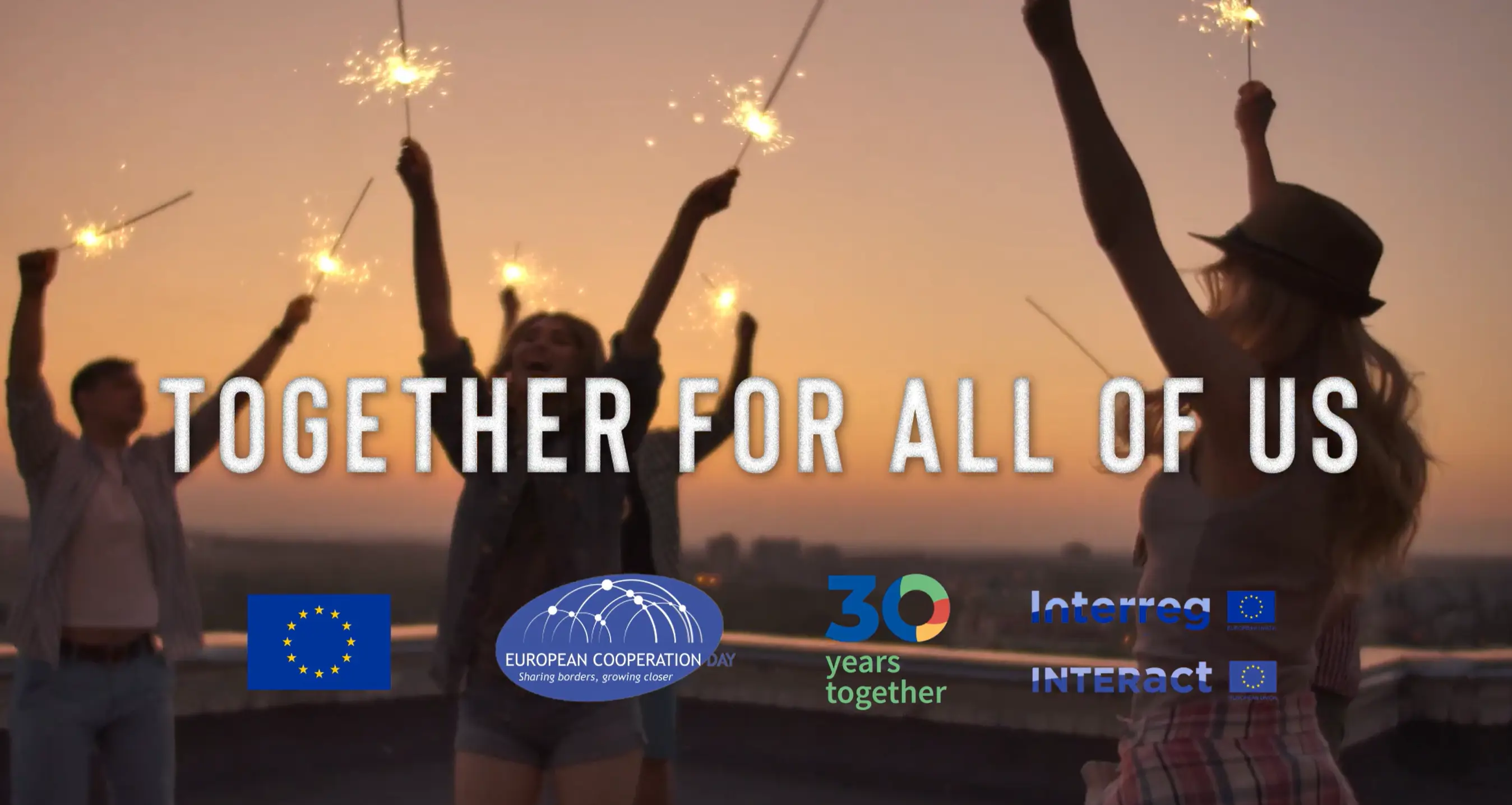 Four people celebrate at sunset holding sparklers, with large text "TOGETHER FOR ALL OF US." Logos for the EU, European Cooperation Day, "30 years together," Interreg, and Interact appear at the bottom.