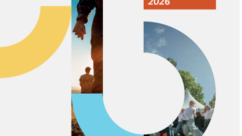 The image shows a creative "15" design with photos inside the numbers, marking an anniversary. "Anniversary" is written in blue, and an orange box reads "Guide for programmes 2026." People are visible in the photo collage.