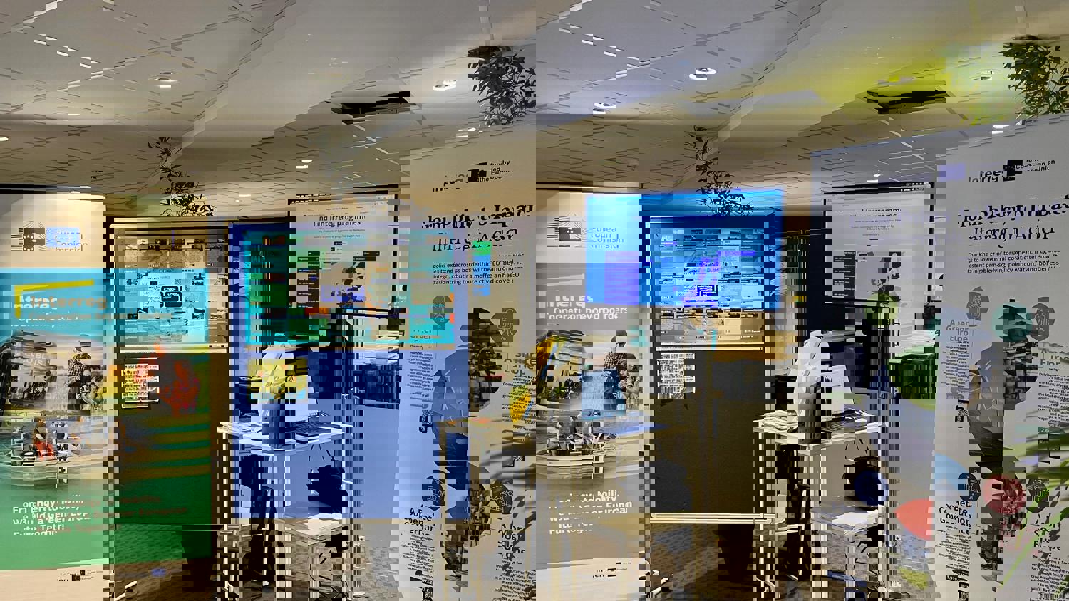 A digital image with horizontal bands of bright colors, including red, yellow, green, blue, and purple, appears distorted with glitch-like pixelation and visual noise.