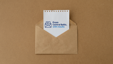 A brown envelope on a brown surface contains a white paper with a blue logo of an envelope and text that reads, "From Central Baltic, with results.