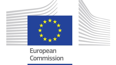 Logo of the European Commission, featuring a blue rectangle with a circle of yellow stars, symbolizing the European Union, alongside stylized grey lines representing a building. Below are the words "European Commission" in grey text.