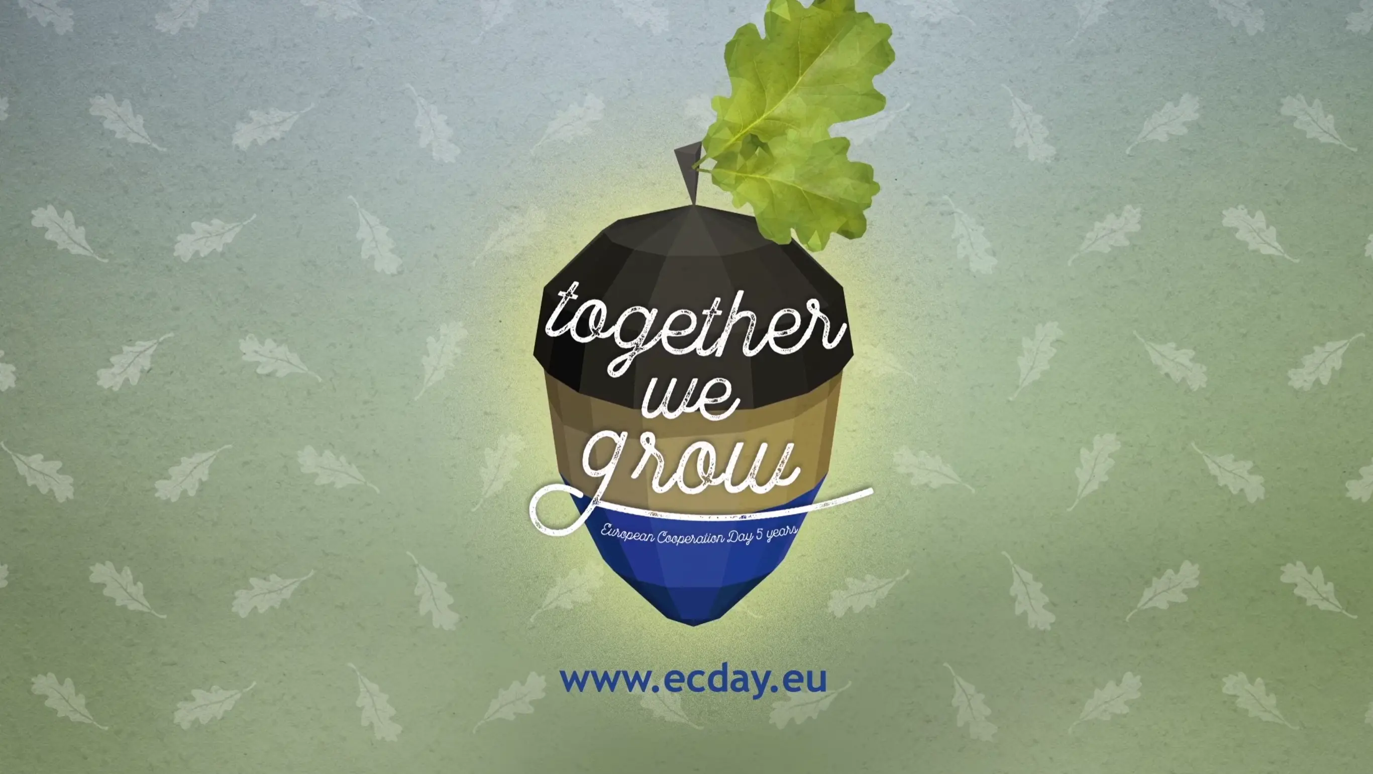 An illustration of an acorn with a green oak leaf on top. The acorn displays the text “together we grow” and a blue ribbon reading “European Cooperation Day September.” Below is the website “www.ecday.eu.”.